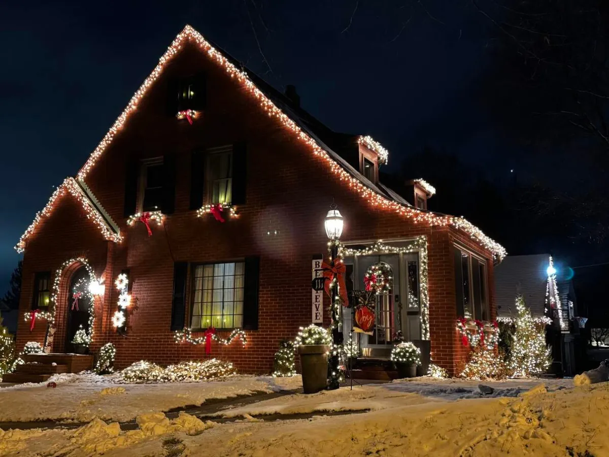 Holiday décor and Christmas lighting on a brick home