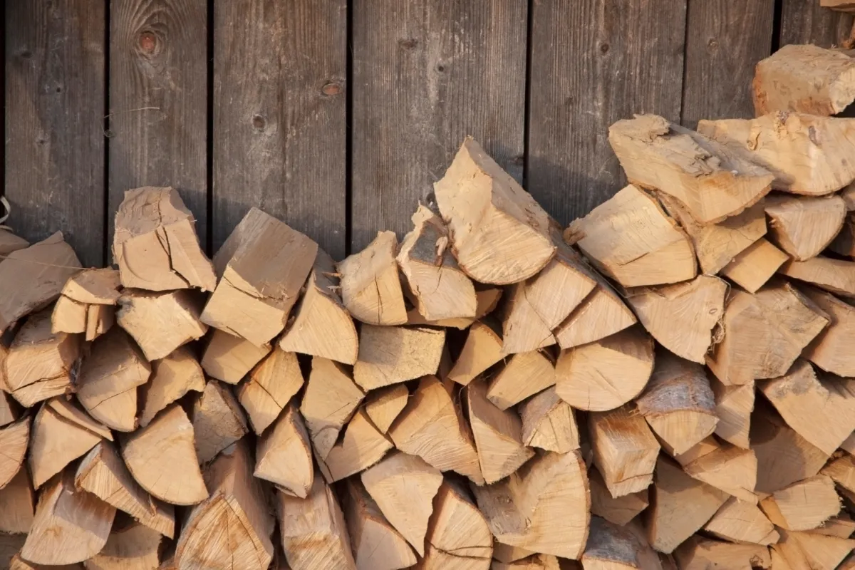 Stacked firewood logs, available for heating and outdoor use in Roanoke Virginia