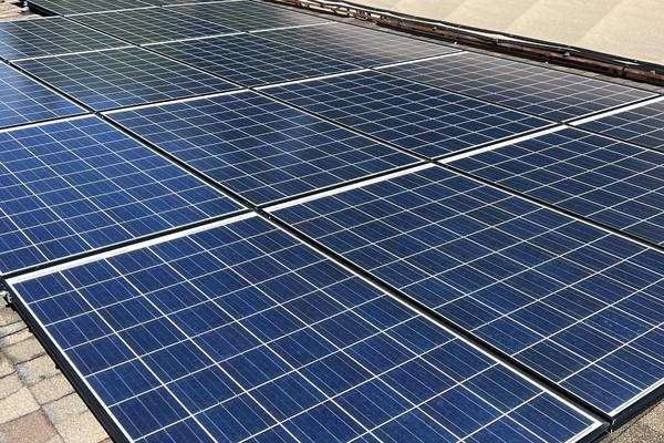 Solar panels on a residential roof showing dust and pollen buildup in Plumas Lake, CA