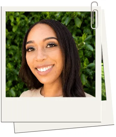 Danielle, a therapist at The Rosemary Tree, smiling in a green cardigan against a natural background, embodying a holistic and strength-based approach to counseling.