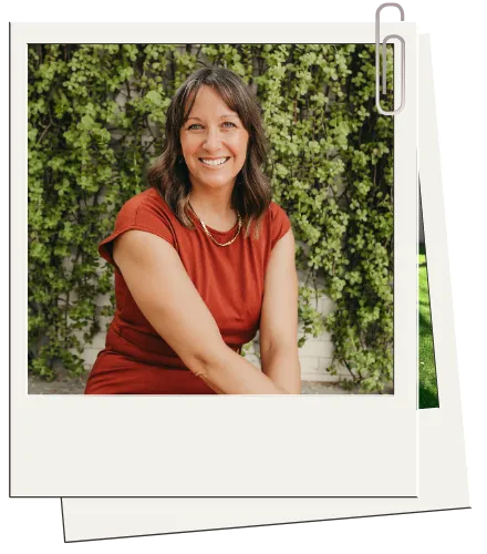 Person standing in front of lush green foliage, wearing a casual olive green top, representing a supportive and welcoming environment for therapy at The Rosemary Tree mental health center.