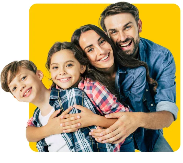 Parents and two children smiling together