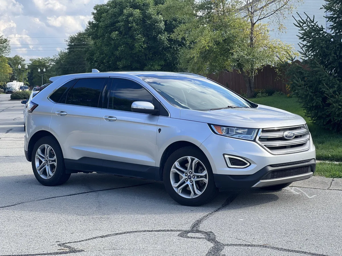 silver Ford SUV on the street