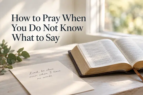 Open Bible and handwritten prayer on cream paper in soft natural window light with the title How to Pray When You Do Not Know What to Say