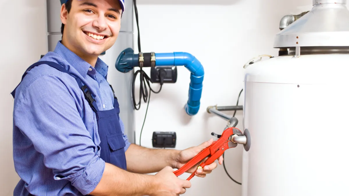 plumber fixing a water heater