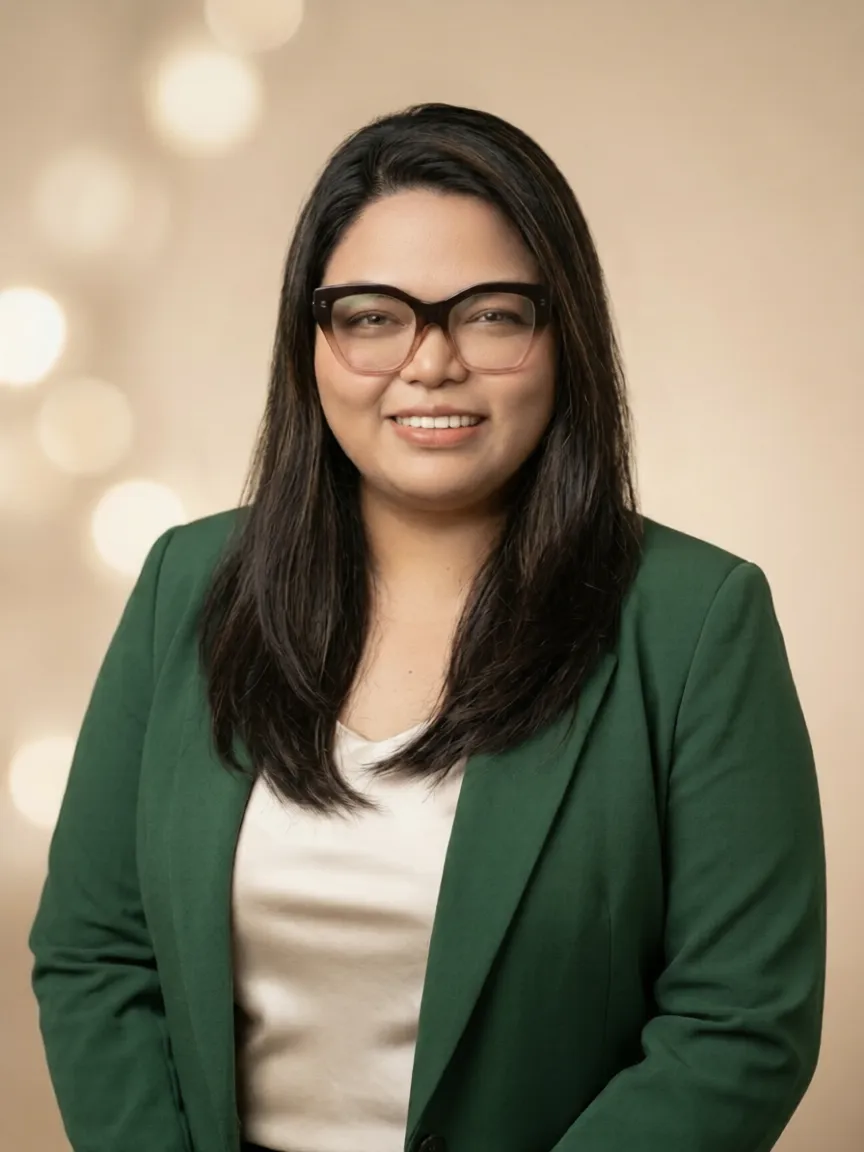 Portrait of MK Bertulfo smiling in a bright, welcoming setting