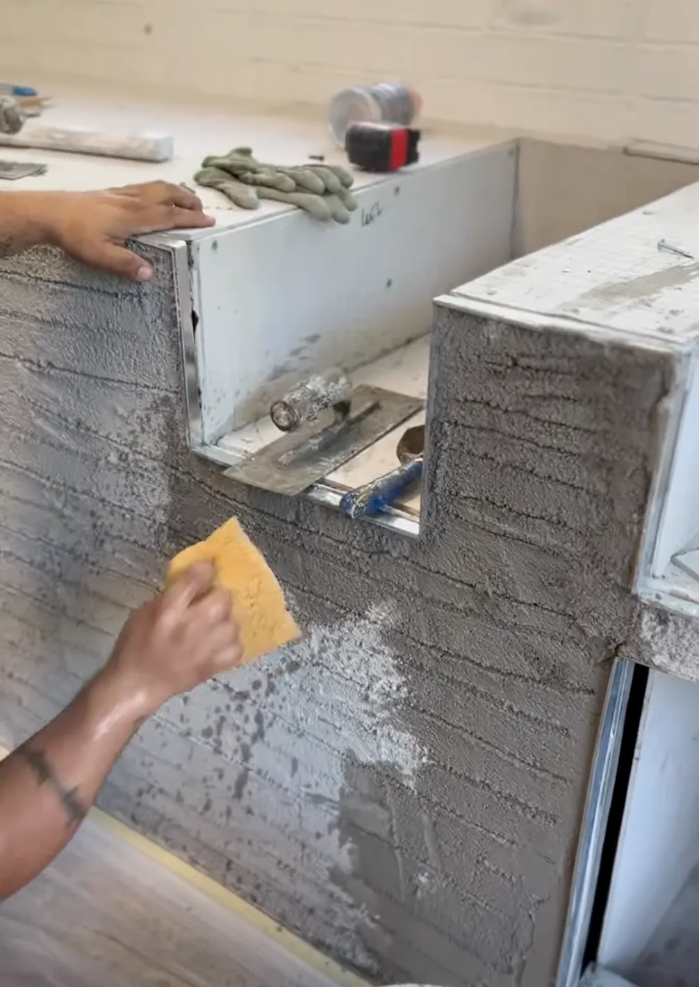 man changing stucco color