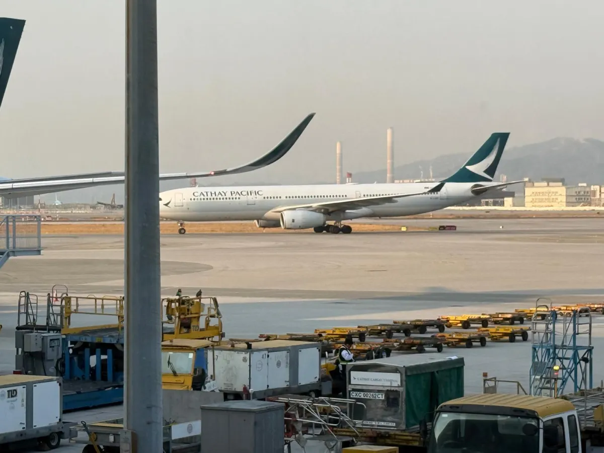 Business owner sitting confidently in a chair in an office
