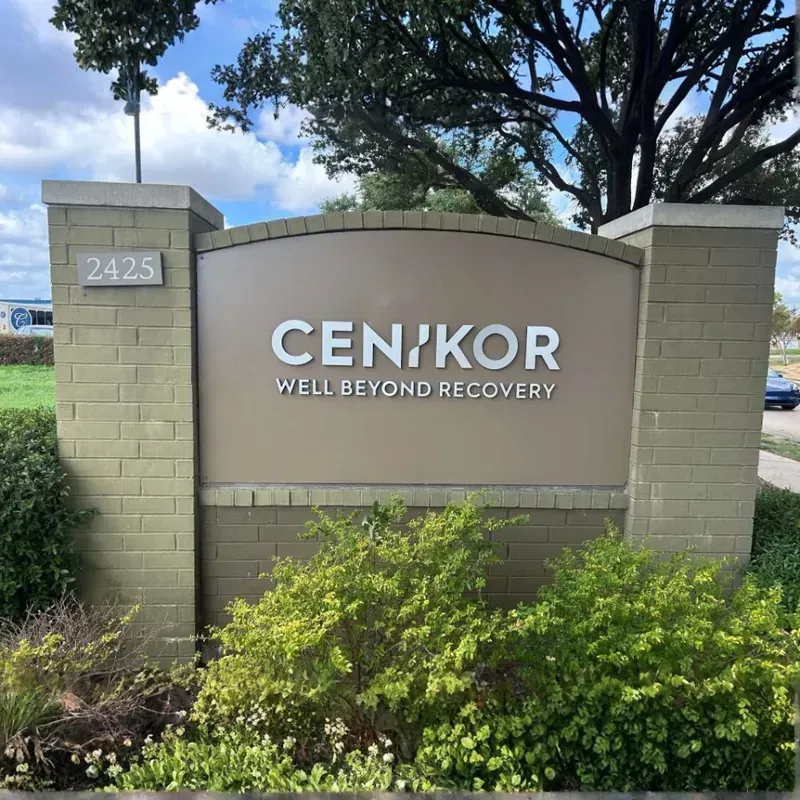 Modern stucco and stone monument sign for Cenikor Well Beyond Recovery with integrated address numbering
