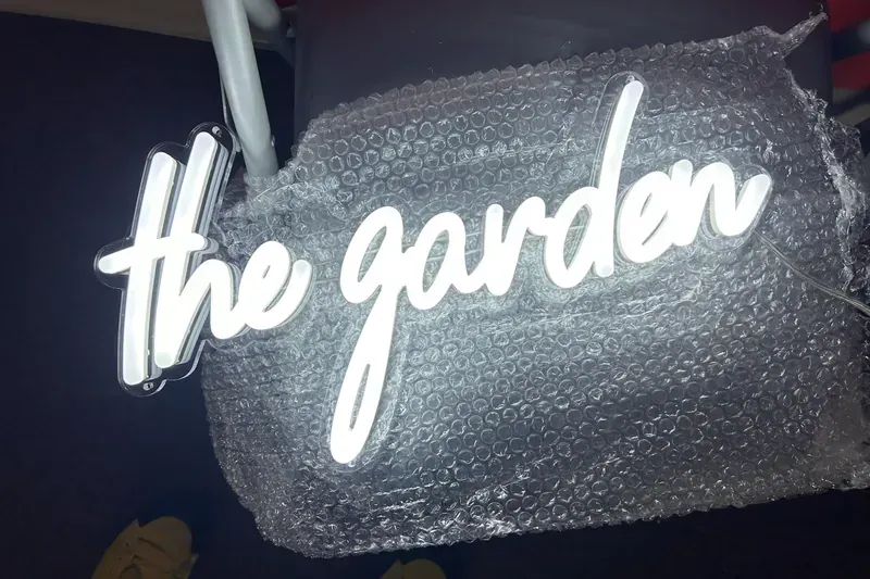 Close-up of aluminum channel letter sign with acrylic face and LED illumination