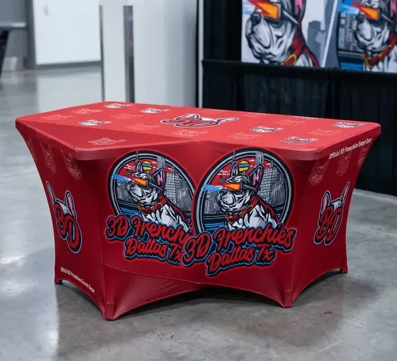 A custom red and black stretch fabric table throw for "3D Frenchies of Dallas" featuring high-quality mascot graphics for a professional booth