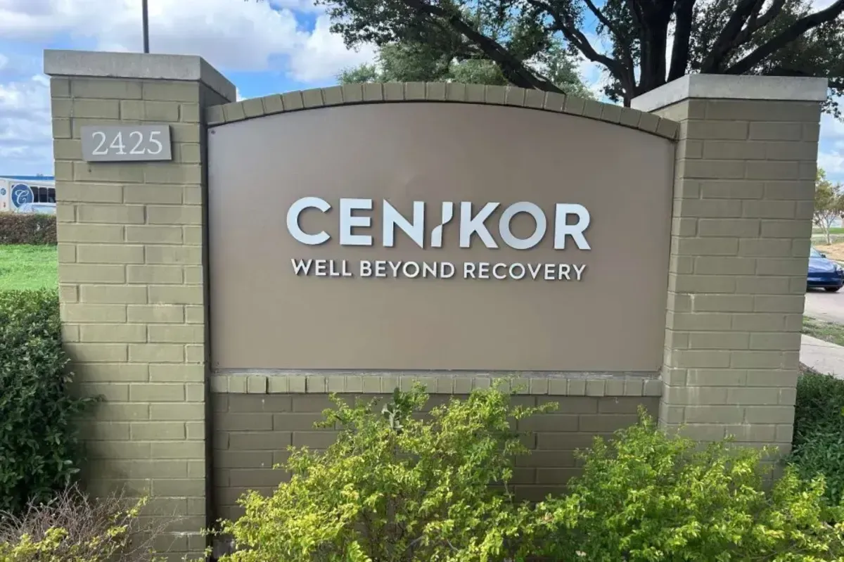 Large stone-base monument sign for CENIKOR Well Beyond Recovery, positioned at an entrance with green landscaping