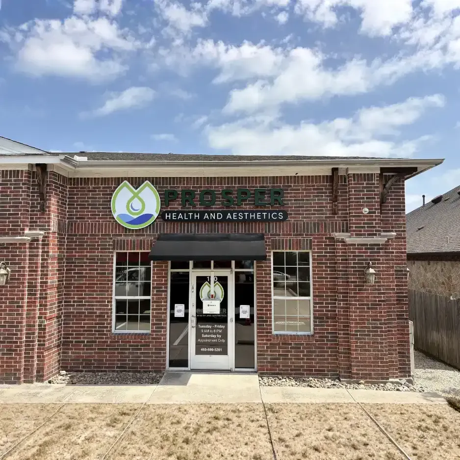 Blue channel letter storefront signage installed on a professional brick office building