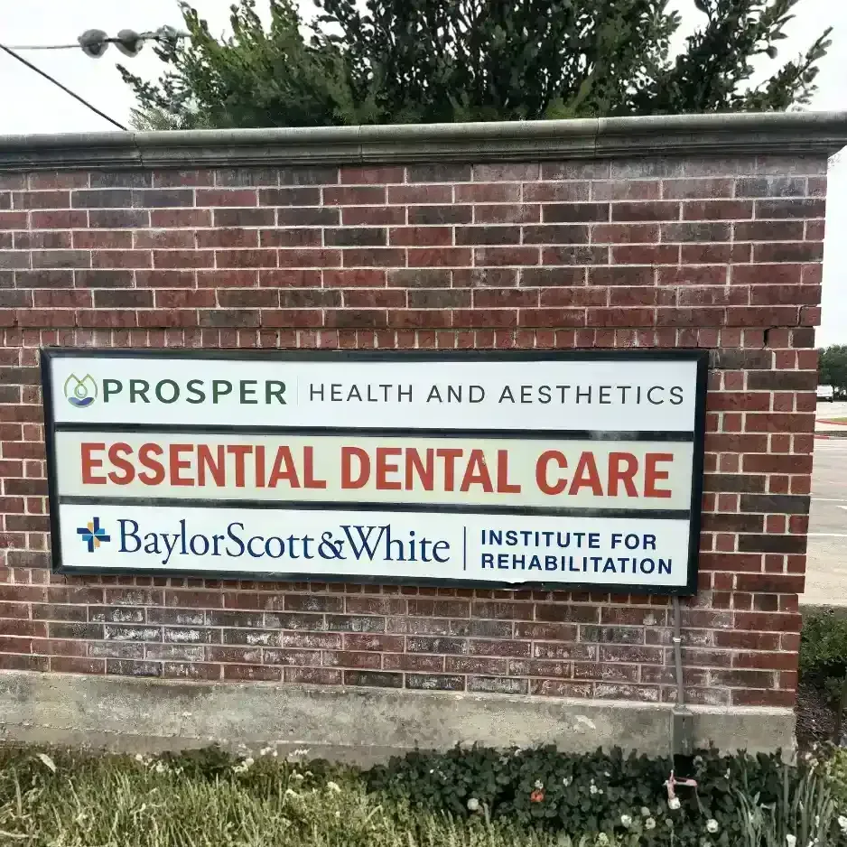 Brick multi-tenant monument sign featuring professional panels for Prosper Health and Aesthetics, Essential Dental Care, and Baylor Scott & White