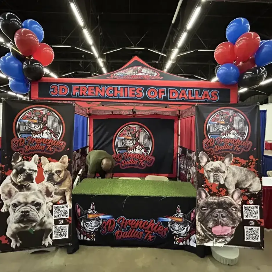 Vibrant tradeshow booth setup with branded banners, patriotic balloons, and a puppy-themed promotional display