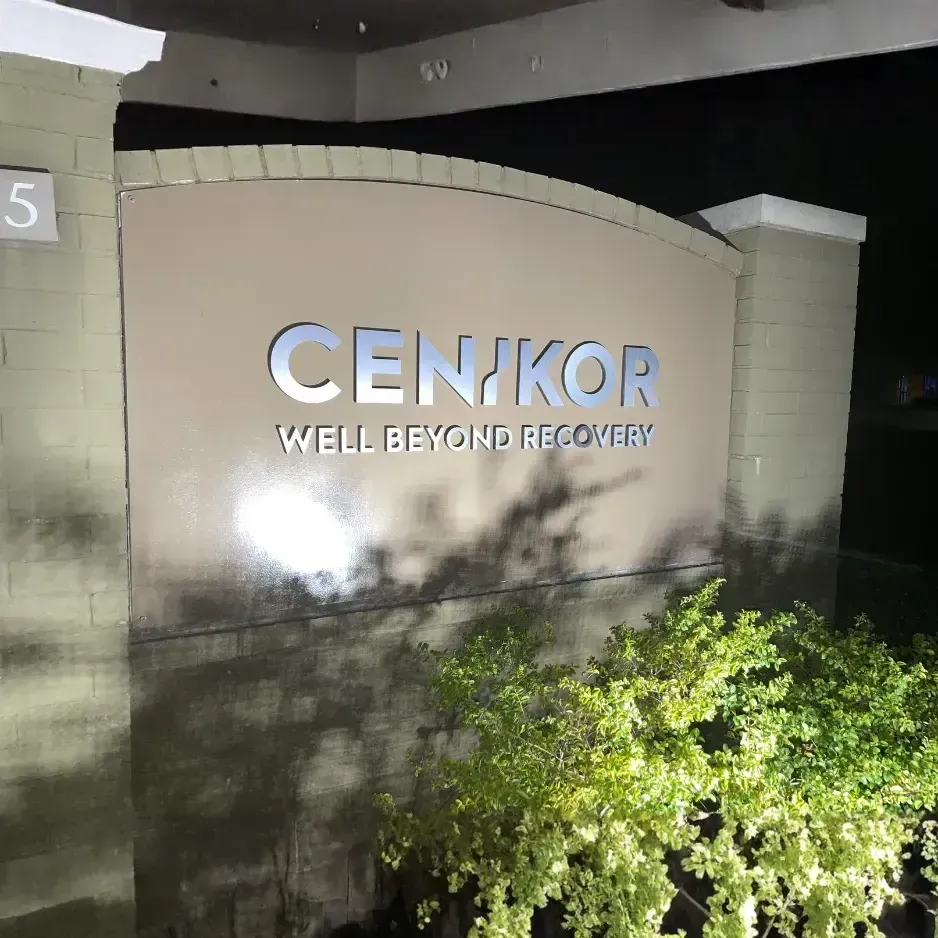 Illuminated nighttime monument sign for Cenikor featuring sleek, modern dimensional lettering