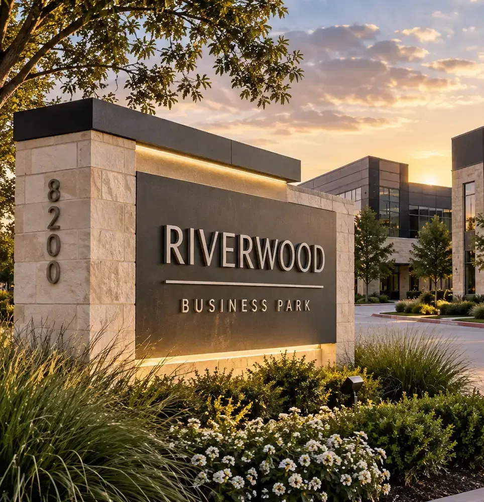 Custom illuminated monument sign at a commercial property entrance in Fort Worth, Texas