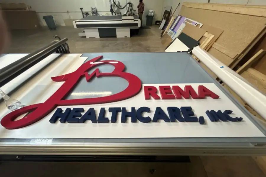 3D dimensional lobby sign for Brema Healthcare showcasing professional corporate branding.