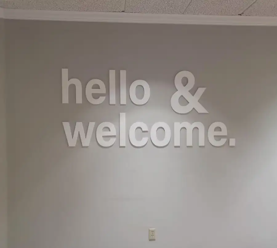 Modern "Hello & Welcome" interior lobby signage for a professional office reception area.