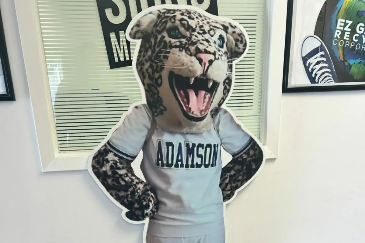 Custom contour-cut vinyl wall graphic featuring the Adamson school mascot for interior branding.