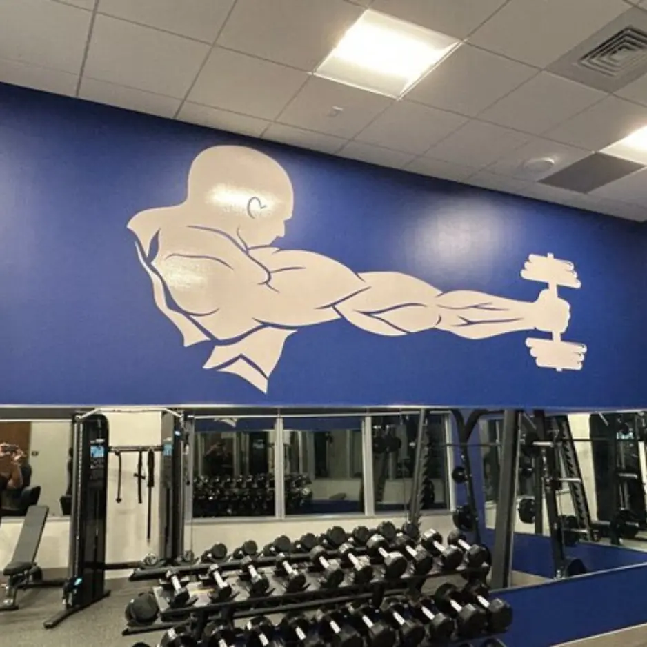 Custom large-format vinyl wall mural for a commercial fitness center and gym.