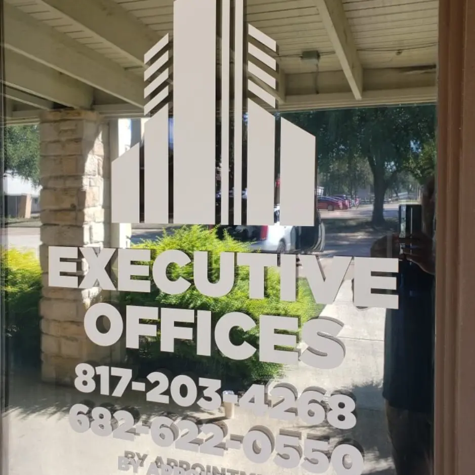Acrylic executive office building directory sign with contact information and custom graphics.