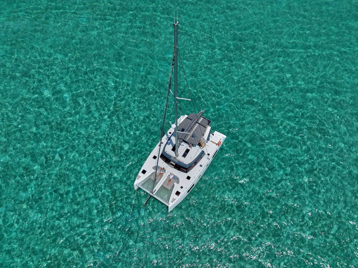 Sea Spirit III from above, anchored in clear turquoise water