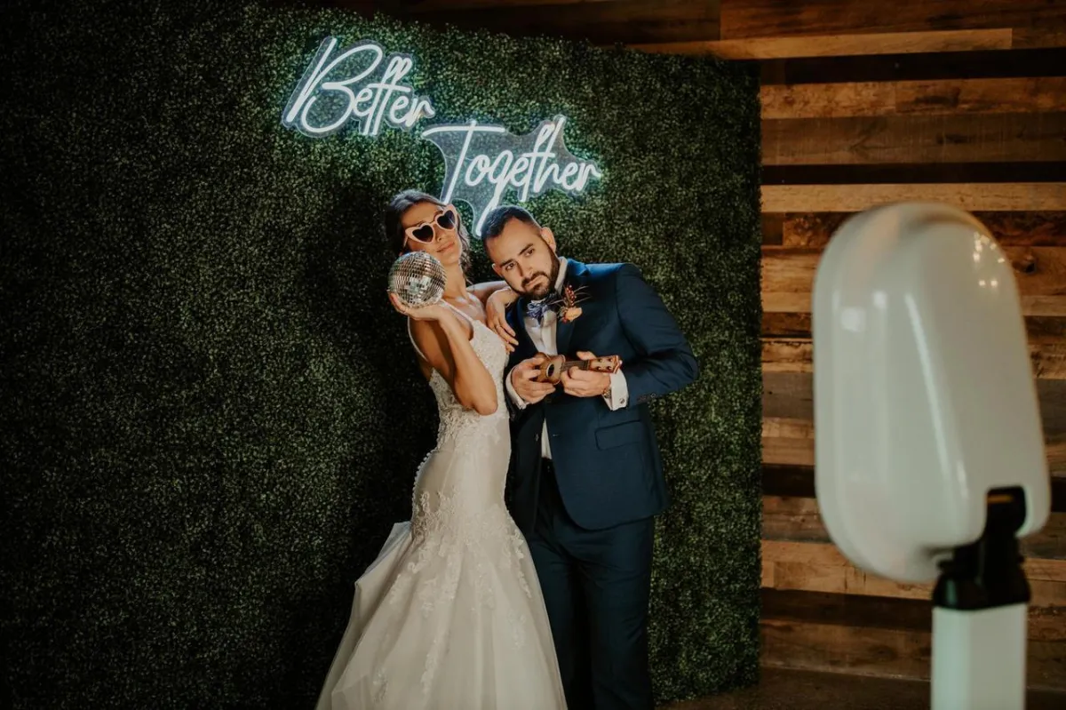 Luxury photo booth setup with custom event backdrop