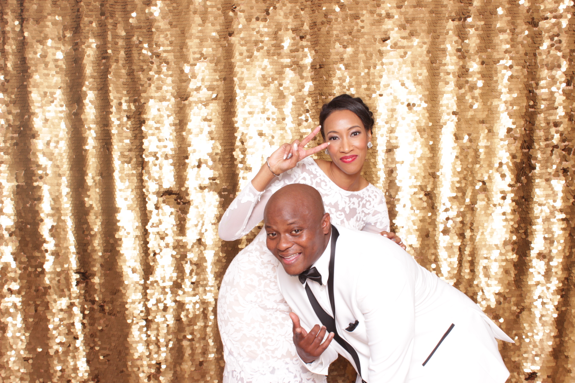 Luxury wedding photo booth with premium gold backdrop