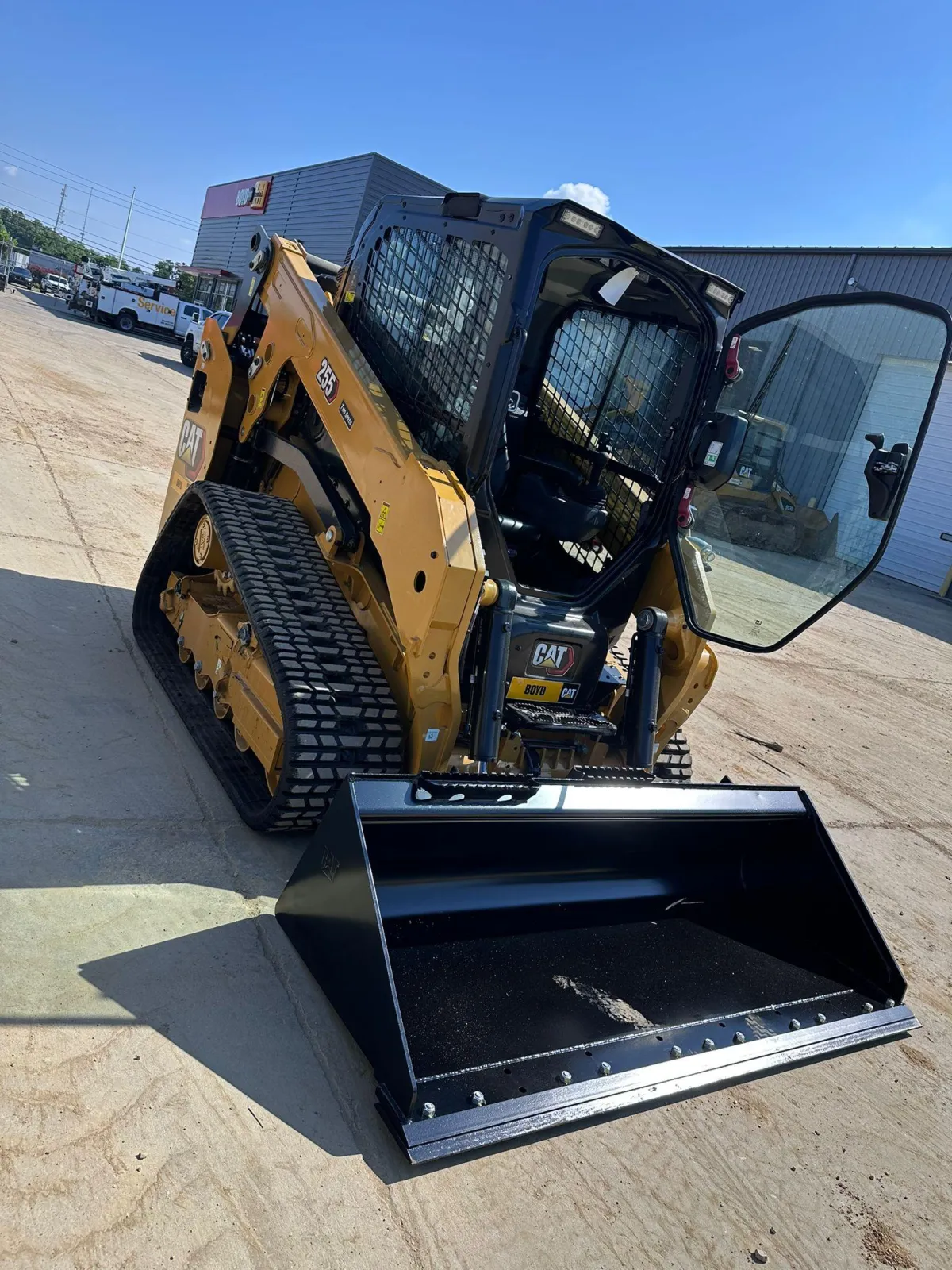 Construction site with excavators and loaders in winter.