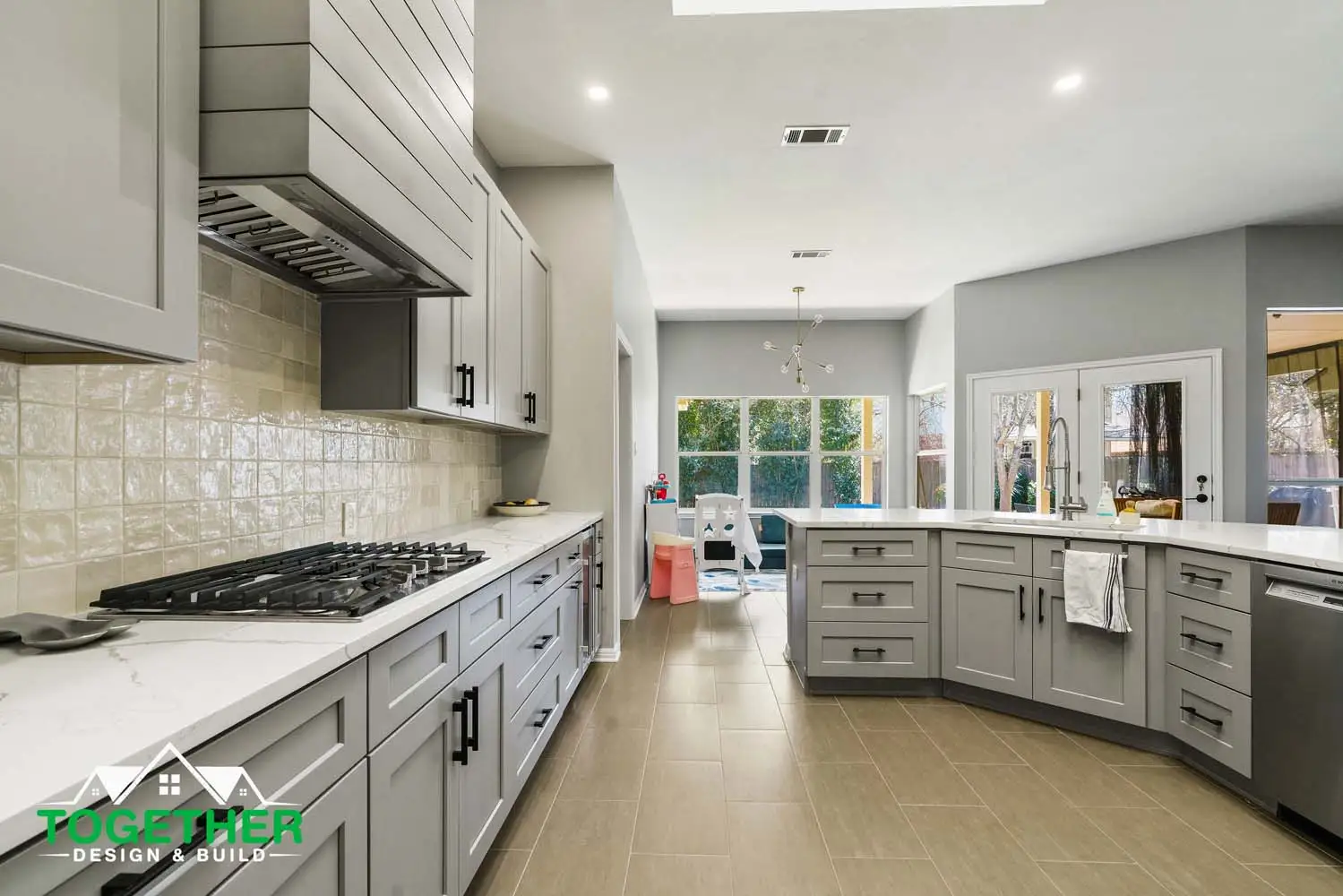 Wide-format photo of a lower-level lounge showcasing layered texture, seating areas, and integrated lighting.