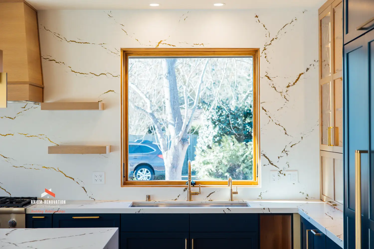 Editorial horizontal image of a custom barrel-room interior with moody lighting, built-in millwork, and rich materials.