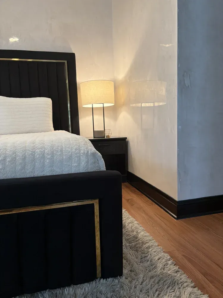 Polished Venetian plaster bedroom walls with soft neutral movement and reflective finish in St. Louis