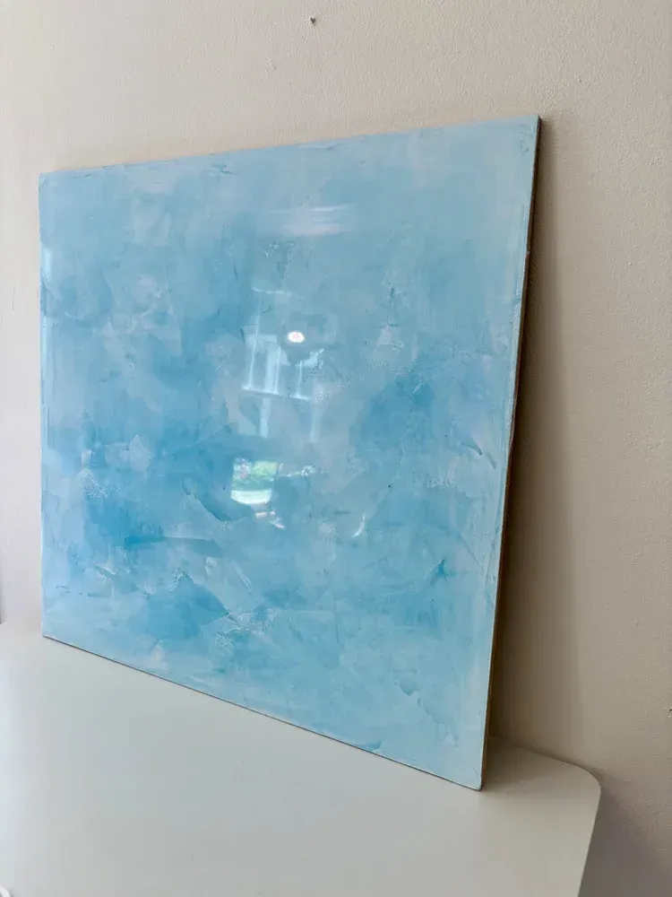 Custom blue Venetian plaster sample showcasing hand-applied movement, depth and polished sheen