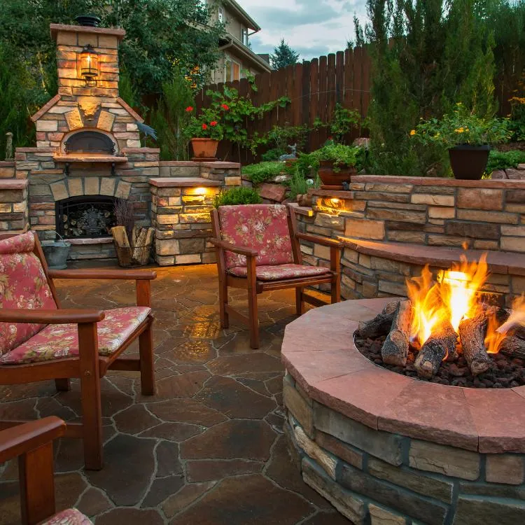 Paver patio with fire pit at night