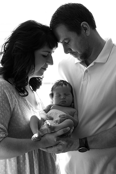 Family of 3 with newborn baby