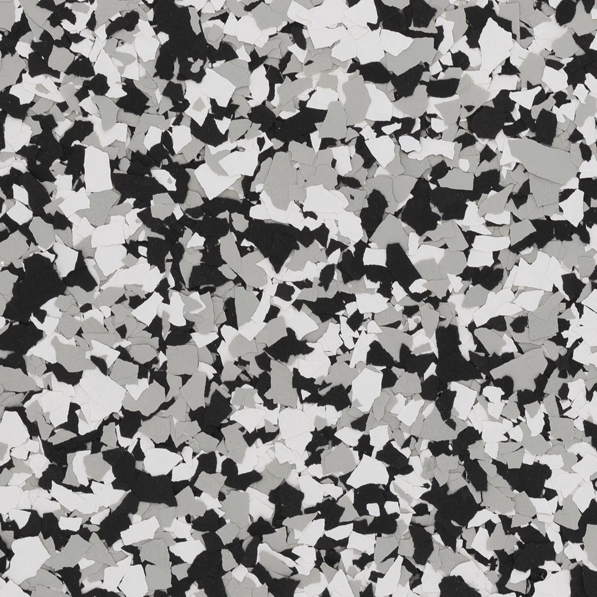 Black, gray, and white epoxy flake blend named Domino, providing a modern monochromatic look for garage floors