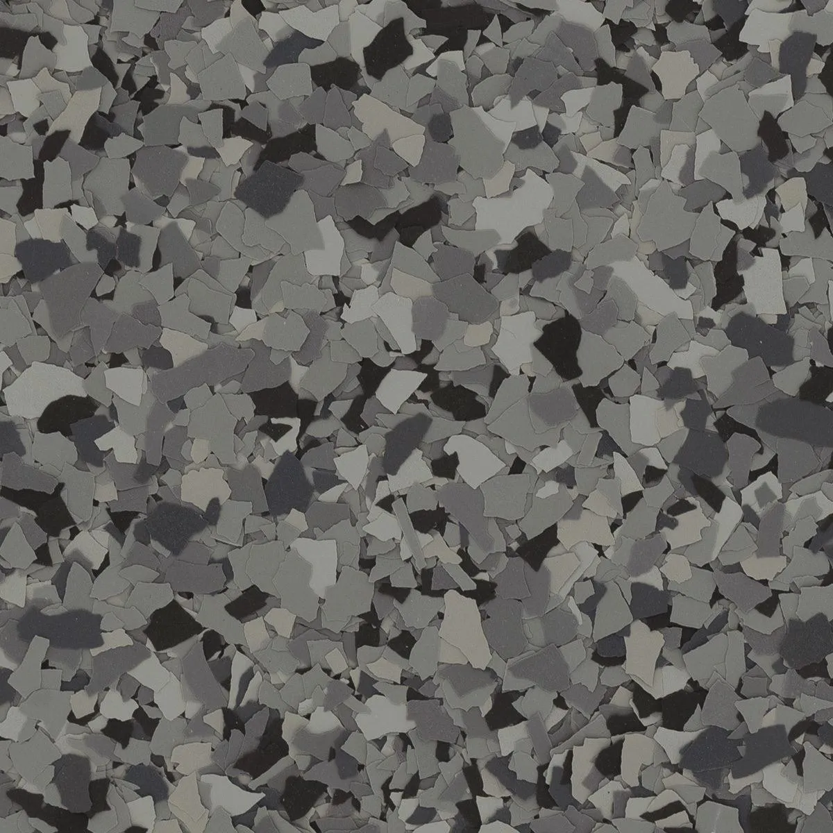 Dark gray and black epoxy flake blend named Nightfall, designed for a sophisticated and subtle garage floor style