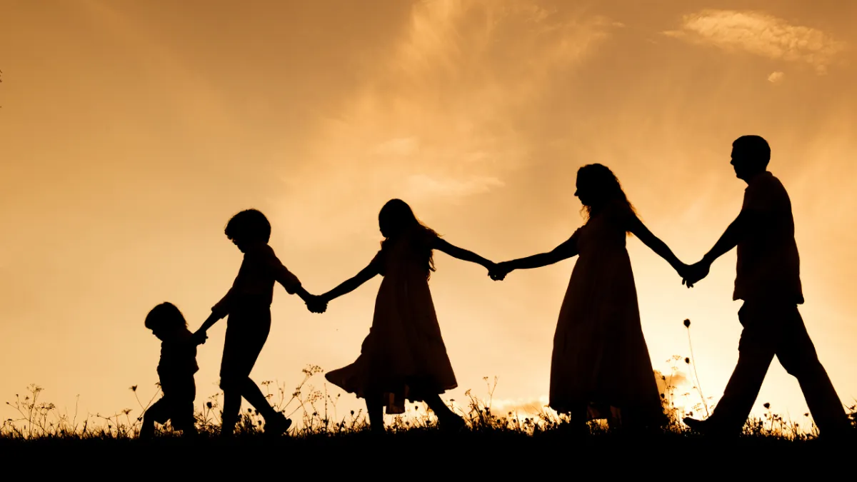 Family Going for a Walk at Sunset
