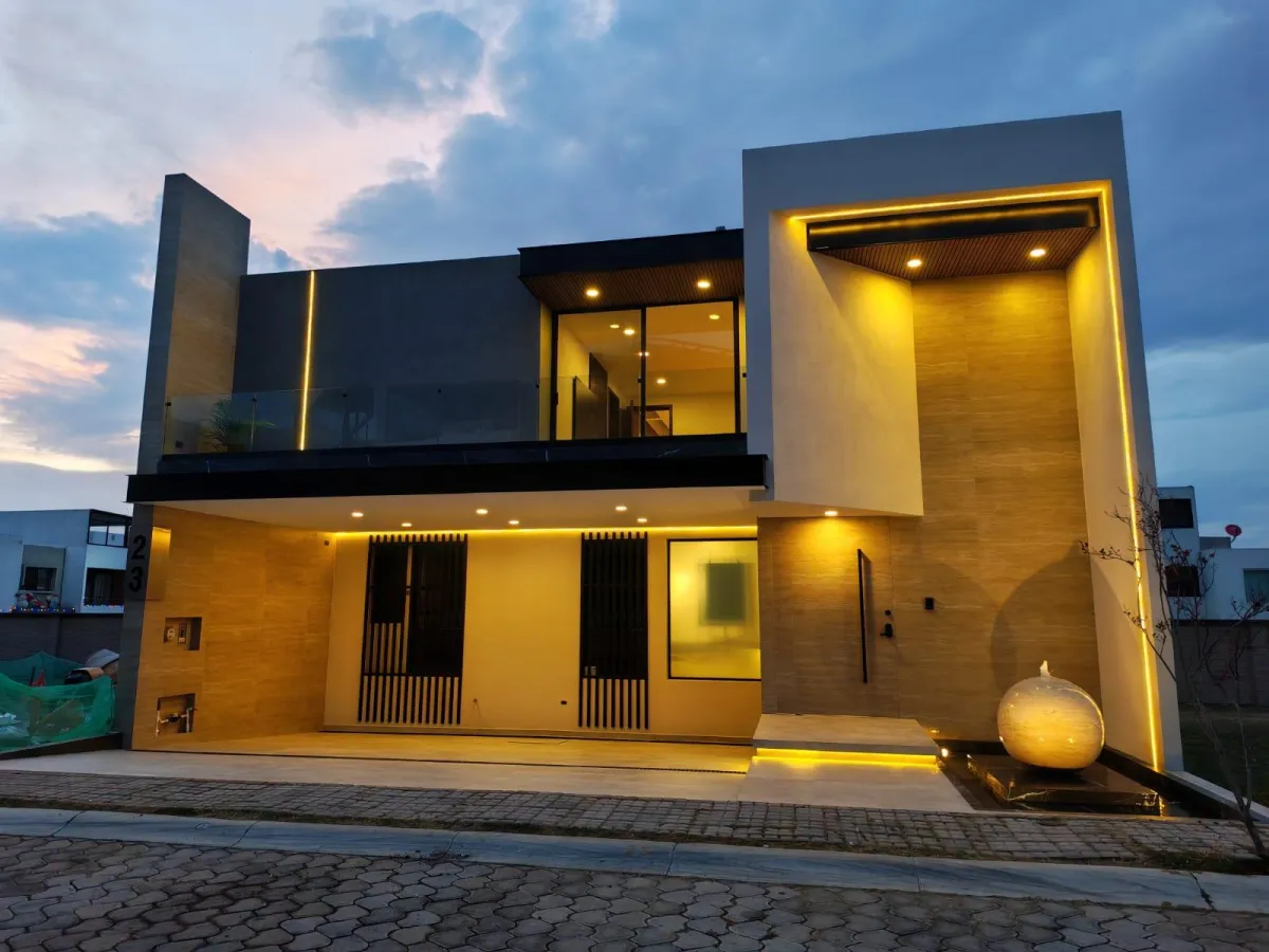 a kitchen with three stools and a center island