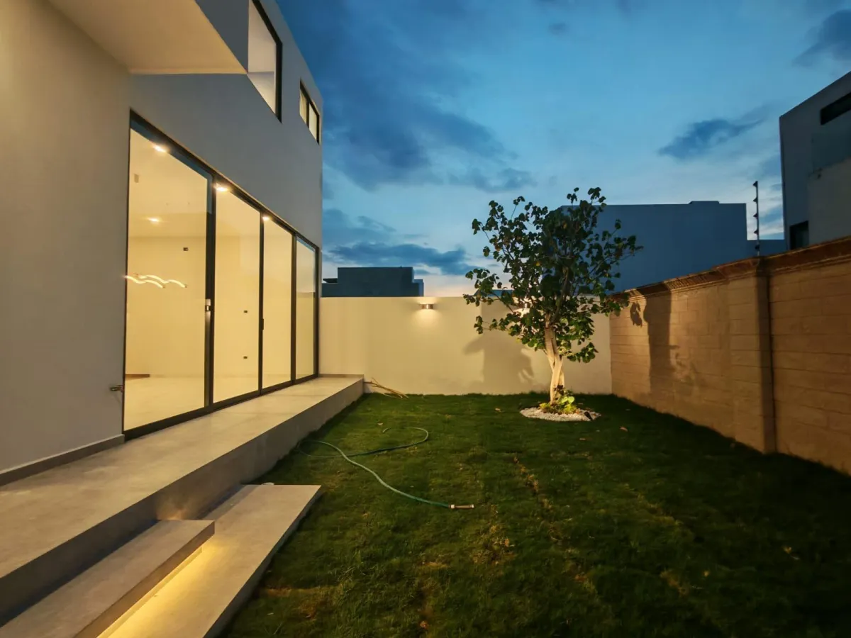 living room with brown sofa and glass window