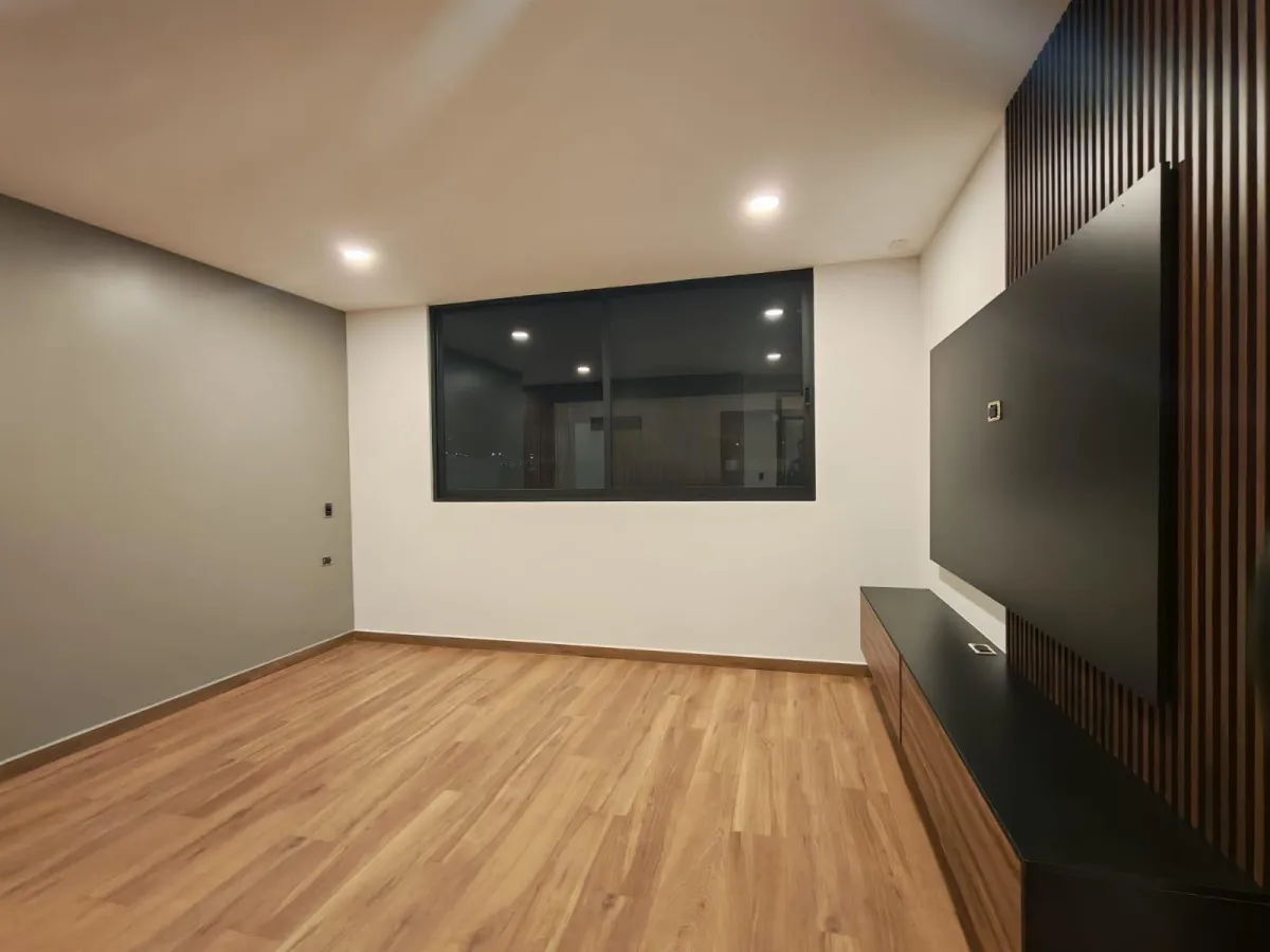 a modern house with a large front yard