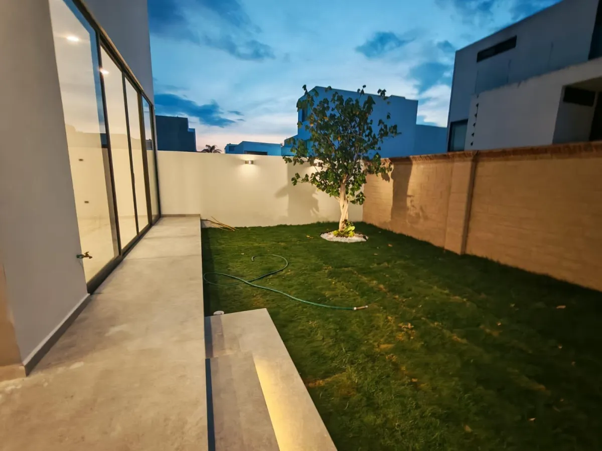 living room with brown sofa and glass window