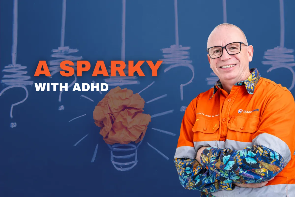 Tradie Coach blog cover for 'A Sparky With ADHD', Paul Rogers in an orange hi-vis shirt stands arms crossed in front of a chalkboard illustration of a lightbulb made from a crumpled paper ball, surrounded by drawn question marks and light rays