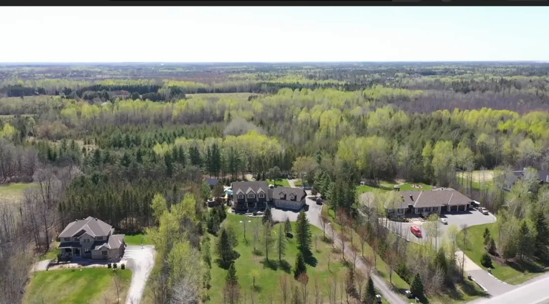 An aerial view over the fields and forest around Stittsville