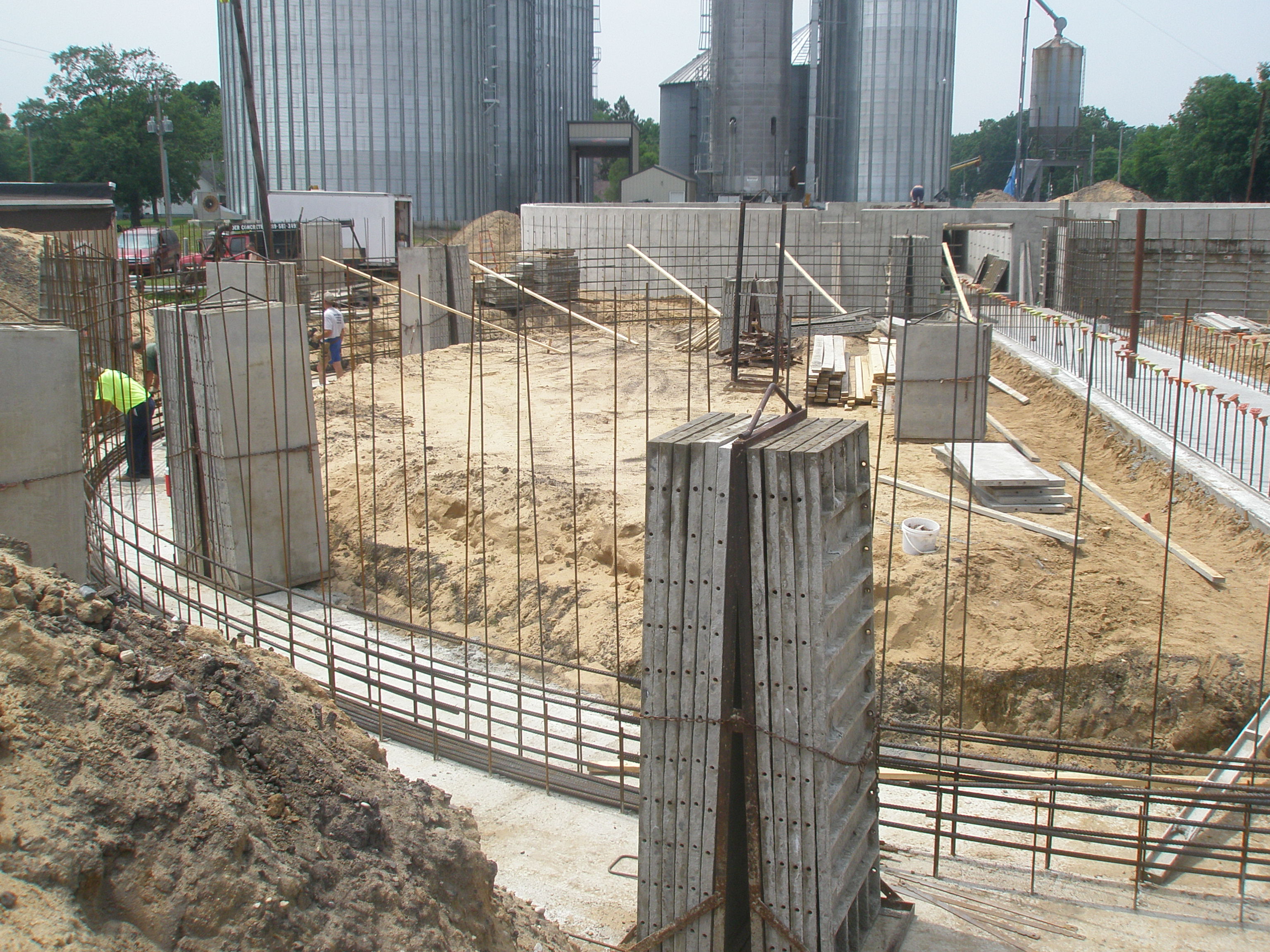 Reinforced concrete walls and columns under construction at a farm site