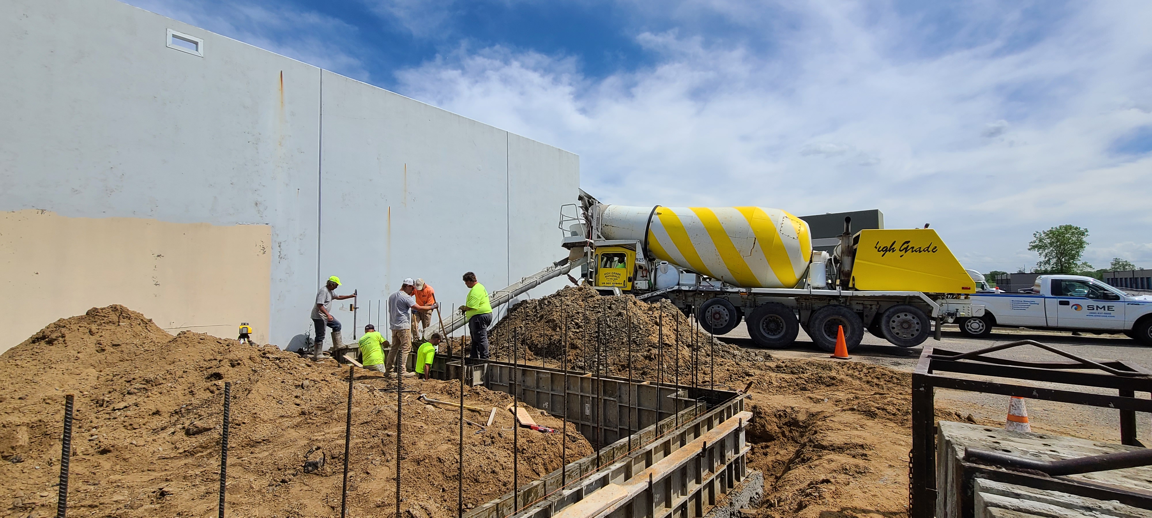 Crew gathered at commercial project site during the day