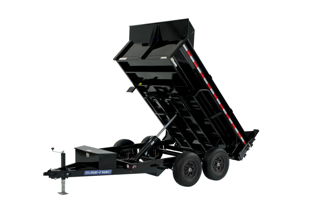 A large excavator and compact loader parked on a construction site at sunrise, with safety cones and freshly moved earth in the background. The equipment is clean and well-maintained.