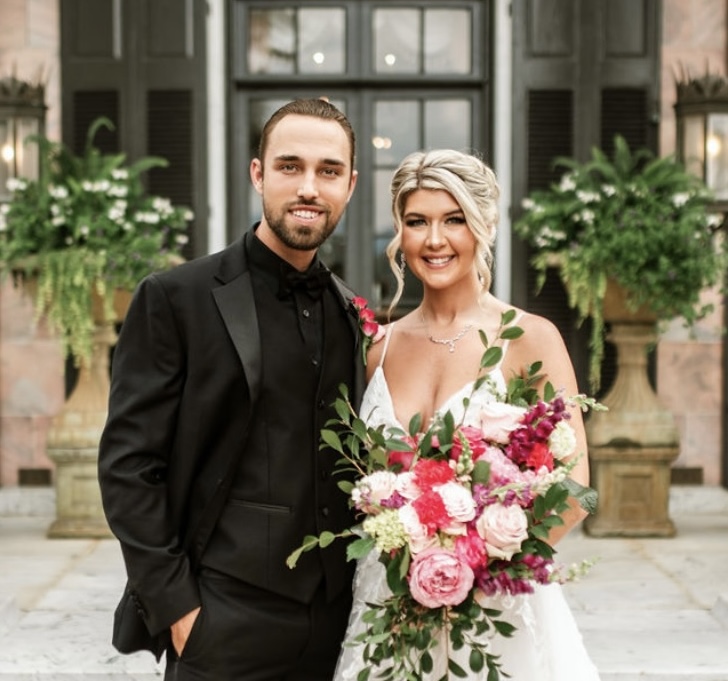 An aerial view of a farm with a train passing by