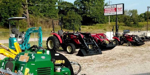 Zerkle Diversified Enterprises equipment lot with Kanga loaders, compact excavators and red tractors